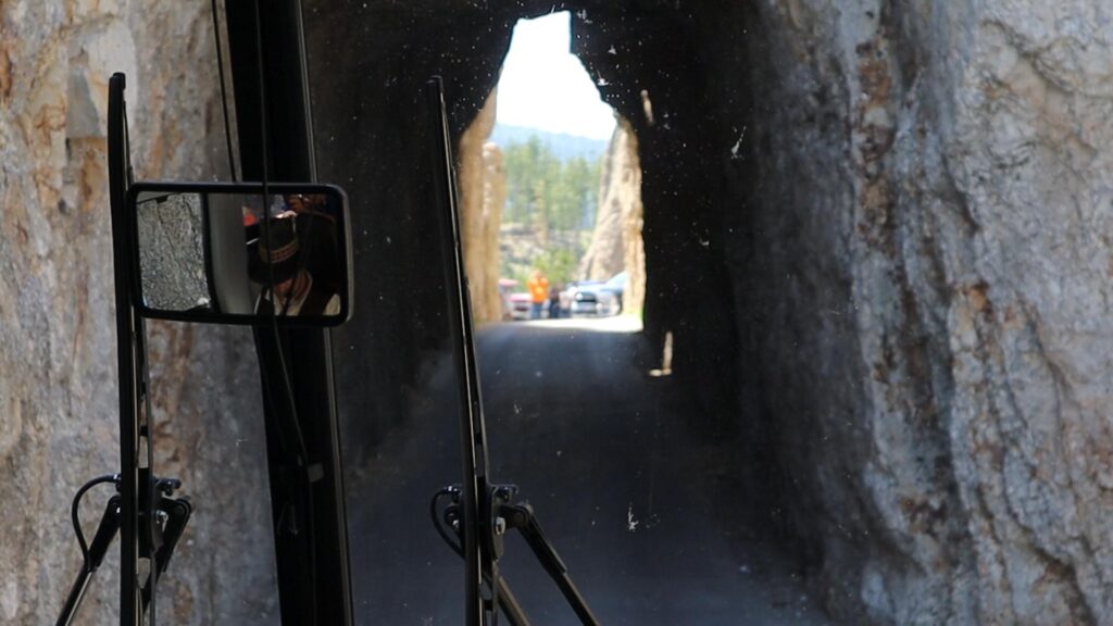 tour bus going through needles tunnel south dakota